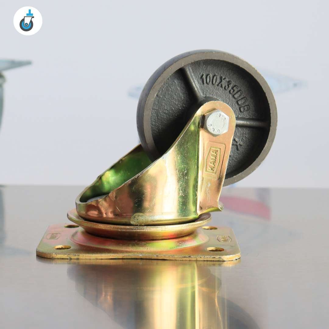 Side view of a 4 inch cast-iron swivel castor with zinc-plated top plate and 360Â° swivel action, ideal for industrial use.